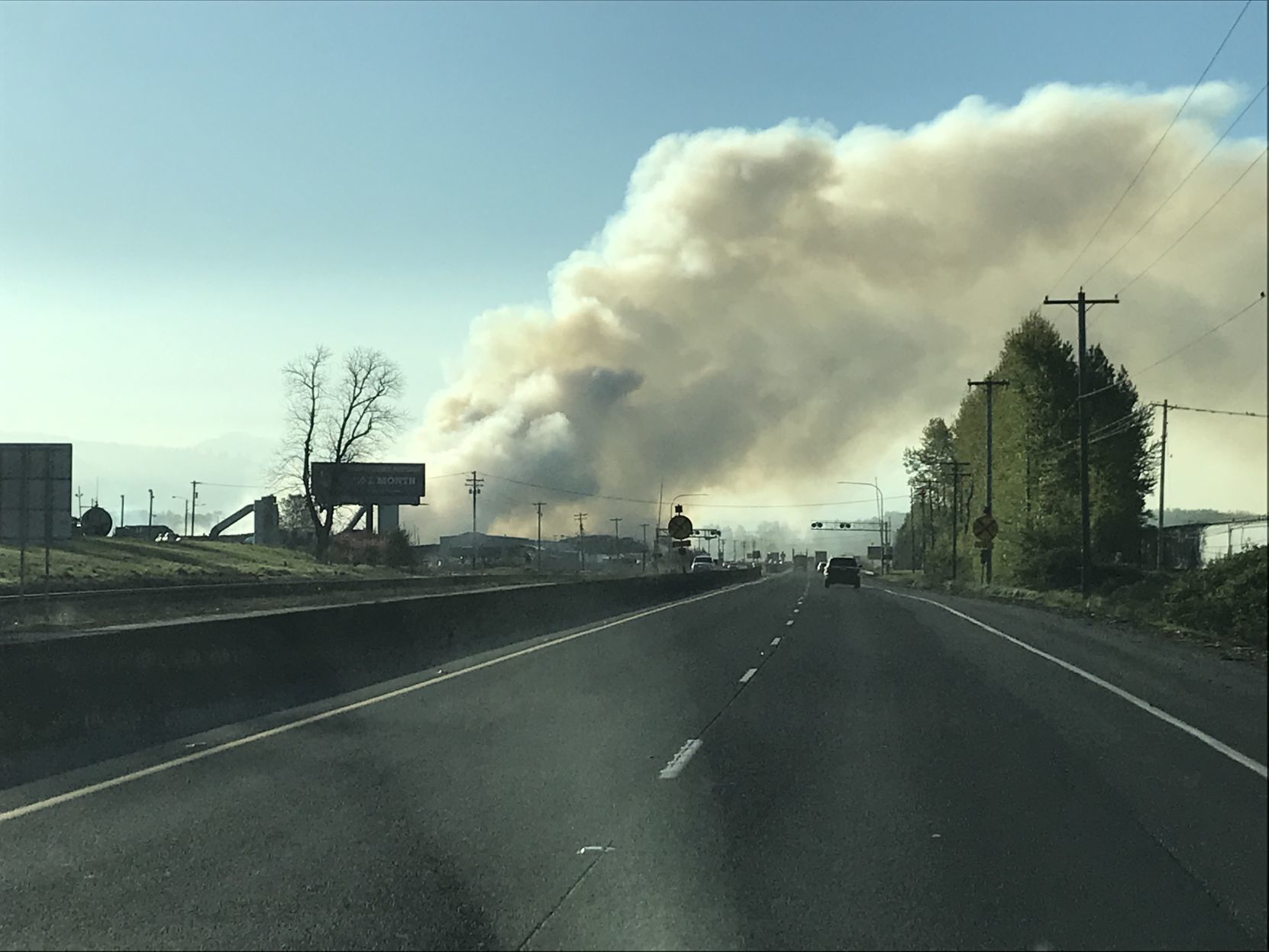Winds blow smoke fire over highway